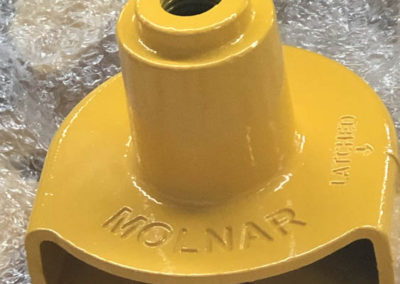 A bracket after being powder coated yellow