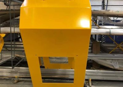 Industrial machine safety covers which have been powder coated safety yellow