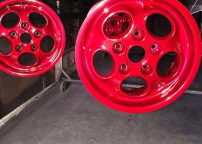 Porsche mag wheels undercoated with bright sliver undercoat with a candy apple red top coat applied