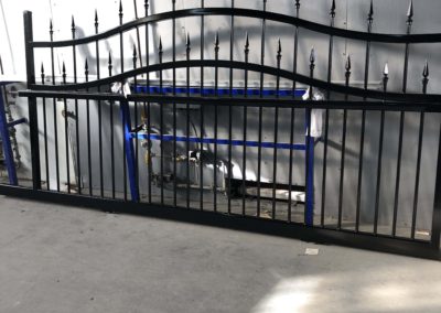 Two varying sized victorian style wrought iron fencing panels after being restored and powdercoated.